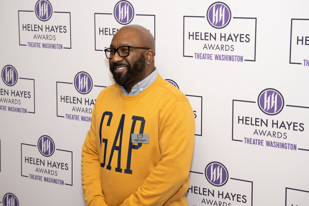 lemar bagley in front of a helen hayes awards backdrop