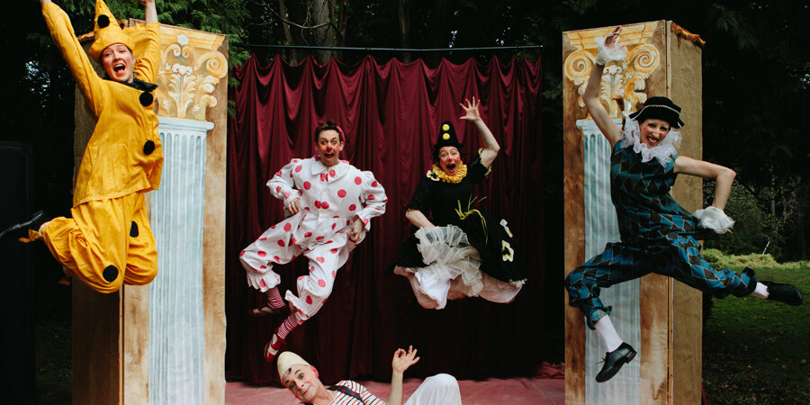 Image of performers leaping and jumping